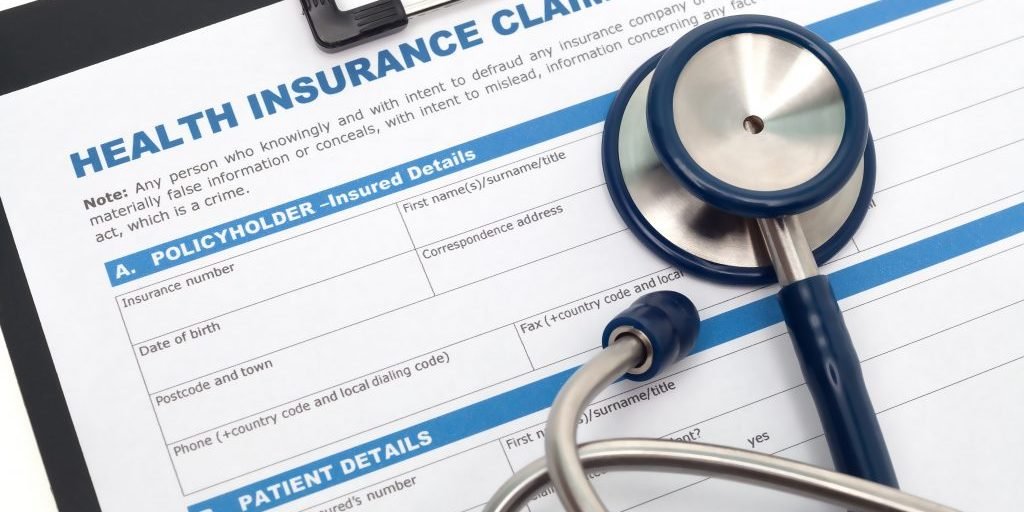 Medical and health insurance claim form with stethoscope on clipboard