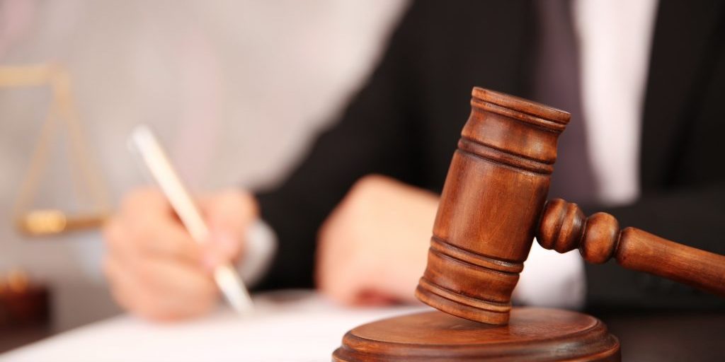 Court hammer on table, closeup