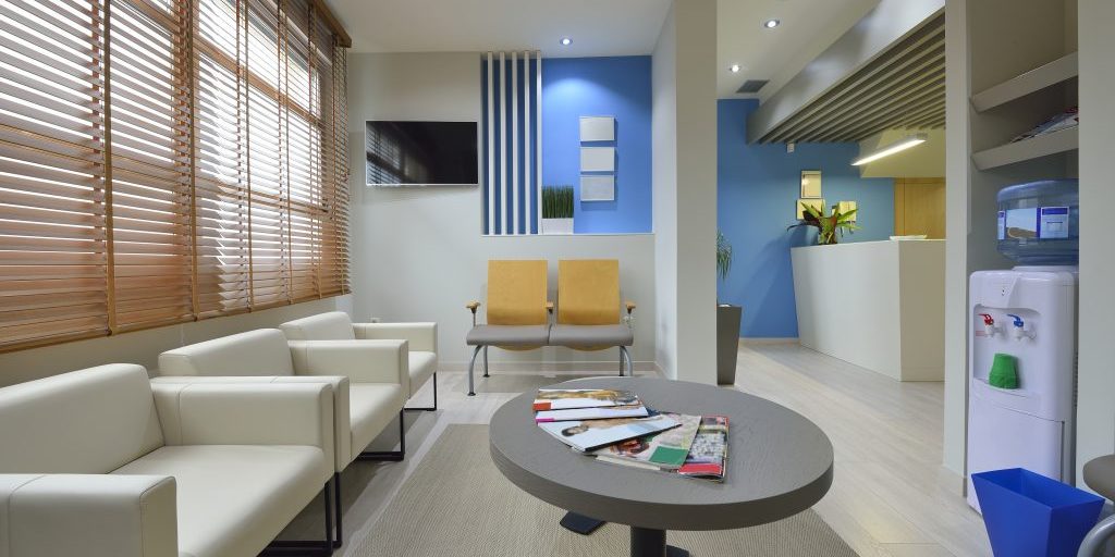 Interior of a modern waiting room. Clinical with empty chairs