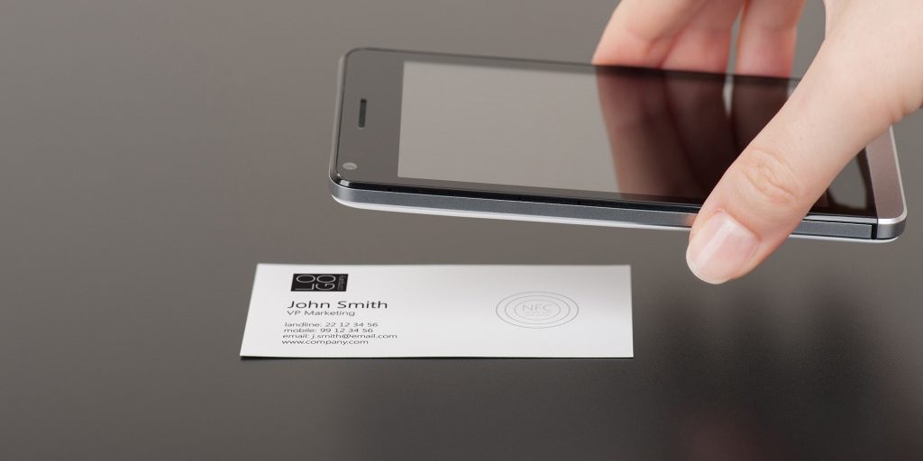 Business card with embedded NFC tag and phone